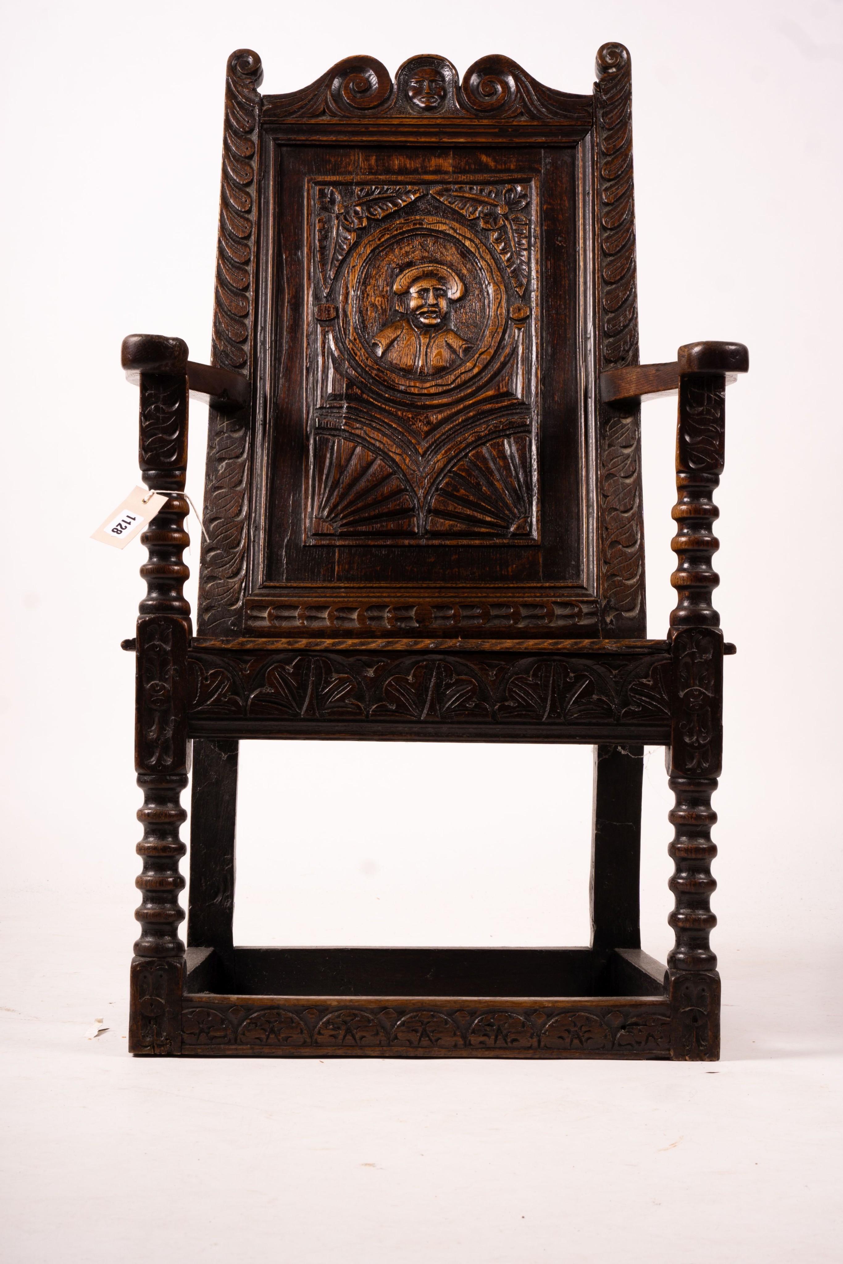 An 18th century style carved oak wainscot chair, width 56cm, depth 60cm, height 101cm